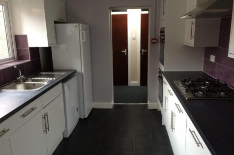 A modern and tidy kitchen with ample storage an...