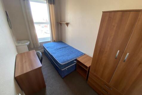 A cozy and well-lit double bedroom, perfect for...