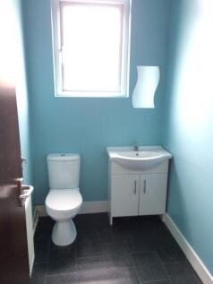 A clean and tidy bathroom with a modern design,...