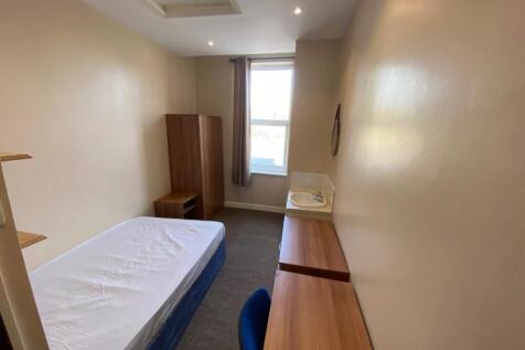 A bright and tidy double bedroom featuring ampl...