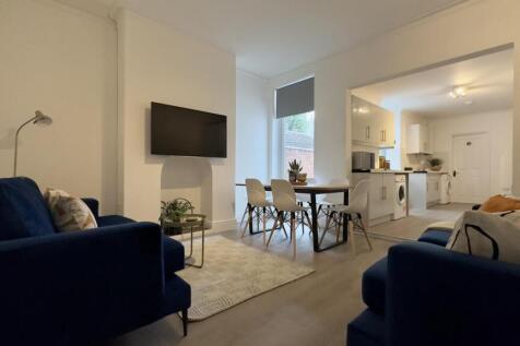 A stylish and spacious modern living room with ...