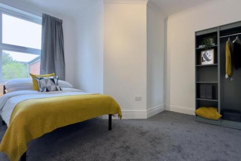 A bright and inviting double bedroom featuring ...