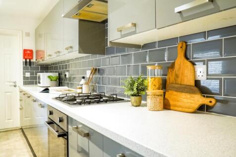 A modern and clean kitchenette featuring sleek ...