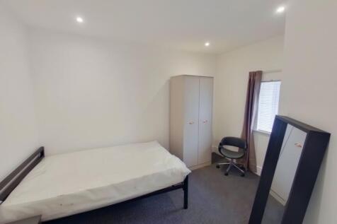 A bright and inviting double bedroom with ample...