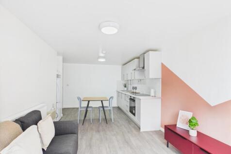 Bright, modern open-plan living area with a com...