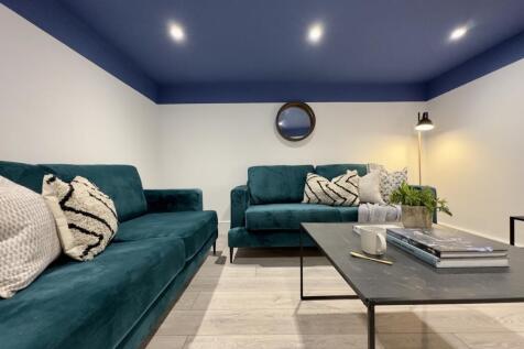 A stylish and spacious modern living room, perf...