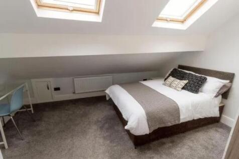 A bright and inviting double bedroom with ample...