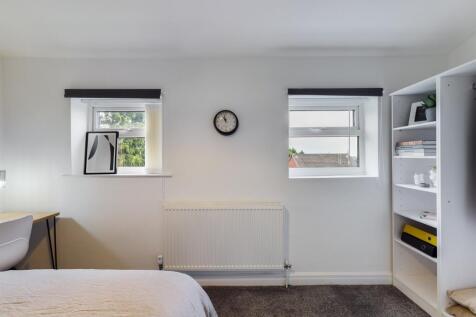 A bright and tidy double bedroom with ample nat...