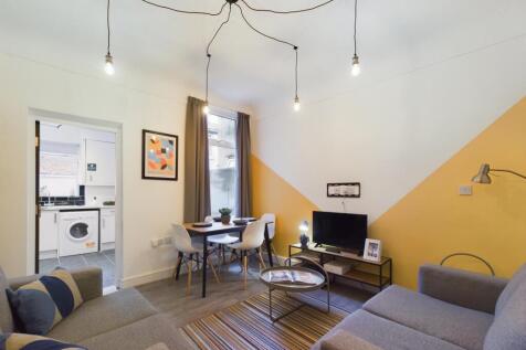 A stylish and spacious modern living room with ...