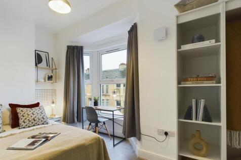A bright and inviting double bedroom featuring ...