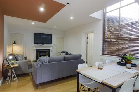 A spacious and stylish modern living room, perf...