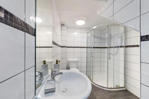 A modern and stylish bathroom featuring a sleek...