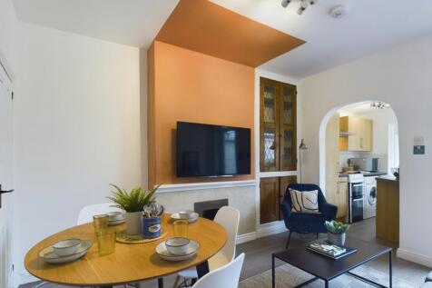 A spacious and modern living room perfect for s...