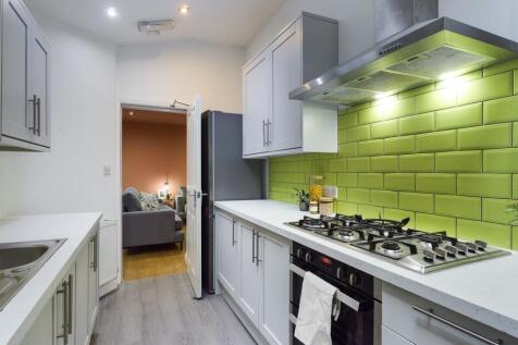 A modern and clean kitchenette featuring stylis...