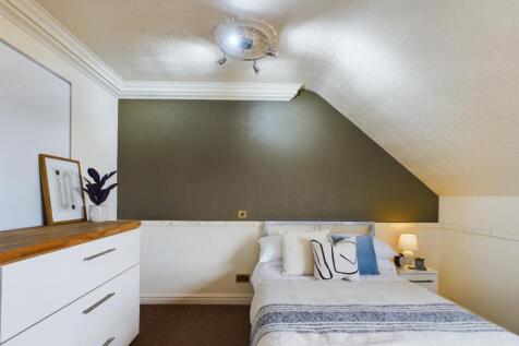 A cozy double bedroom featuring stylish decor a...