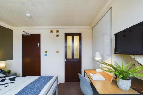 A bright and inviting double bedroom featuring ...