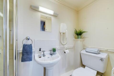 A clean and well-maintained bathroom featuring ...