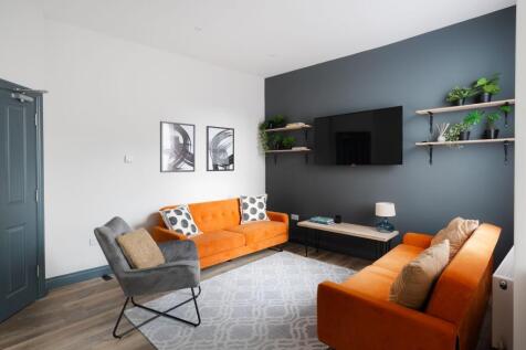 Bright contemporary living room with two vibran...