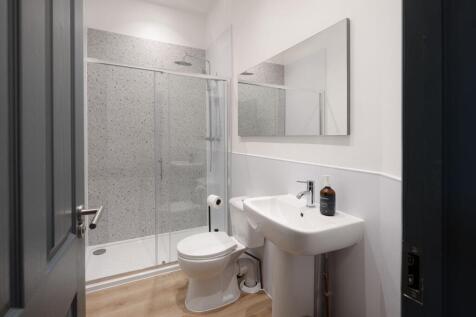 Modern, well-fitted bathroom with a walk-in sho...