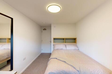 Bright and inviting double bedroom with a comfo...
