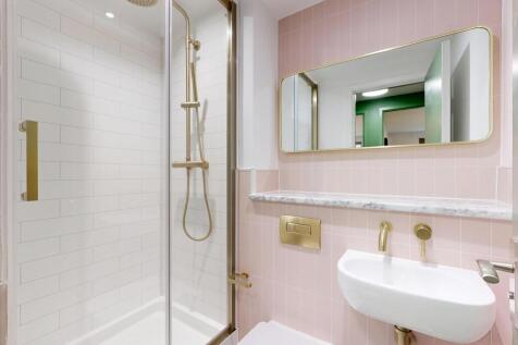 A well-maintained bathroom featuring a shower w...