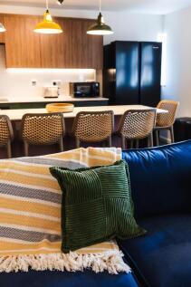 Bright, modern open-plan living area with a com...