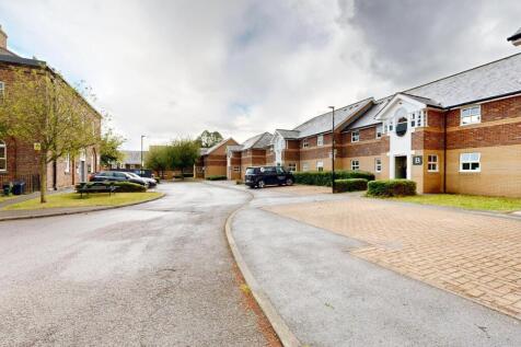 Well-maintained residential street with modern ...