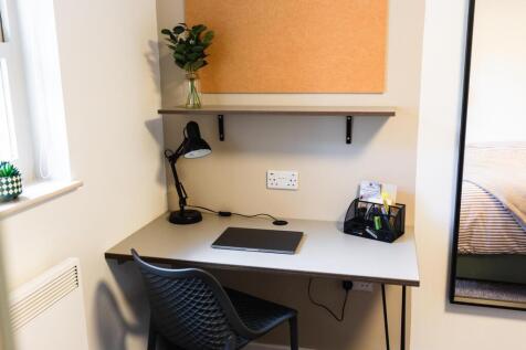 Neatly arranged study nook with a modern desk, ...
