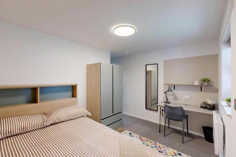 Bright, modern bedroom with a comfortable doubl...