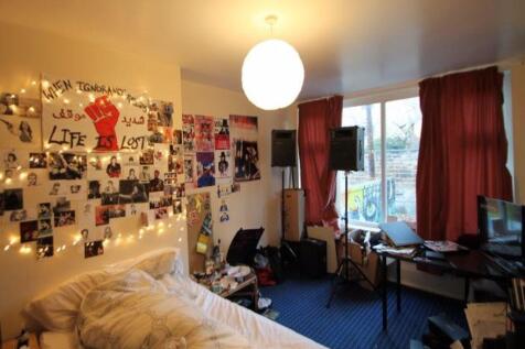 Cozy and personalized bedroom corner with a com...