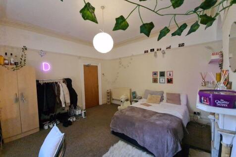 Bright and welcoming master bedroom featuring a...