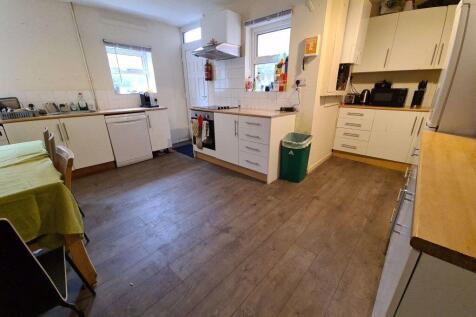 Bright and modern kitchen with ample counter sp...