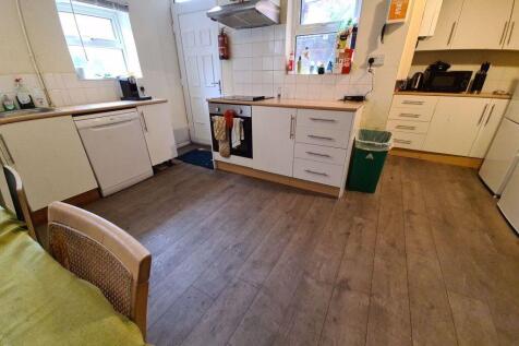 A bright and well-maintained kitchen with ample...