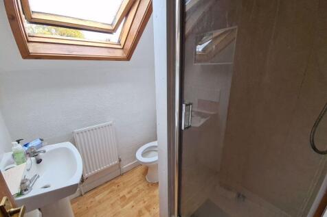 A clean and well-maintained bathroom with a sho...