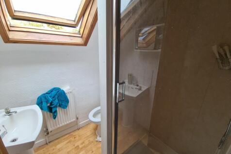 A modern bathroom with a shower cubicle, featur...