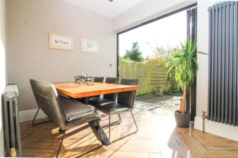 A bright and inviting communal workspace featur...