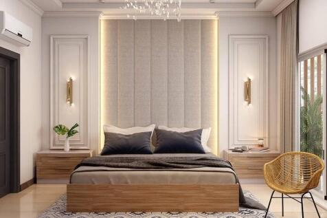 A spacious and elegantly designed master bedroo...