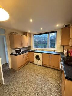 Bright and functional kitchen featuring ample c...