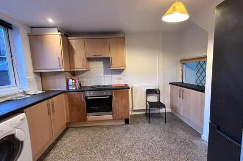 A well-maintained kitchen featuring wooden cabi...