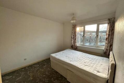 A simple double bedroom with a comfortable bed ...