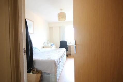 Bright double bedroom featuring a comfortable b...