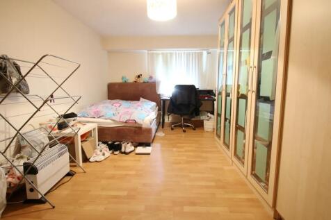 Bright double bedroom featuring a comfortable b...
