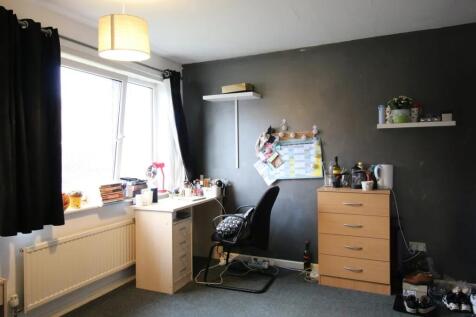 A bright and practical single bedroom featuring...