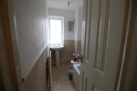 A neat and functional bathroom featuring a pede...