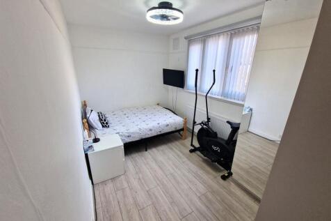 Bright and tidy double bedroom featuring modern...