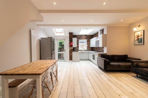 Bright open-plan living area with a modern fitt...