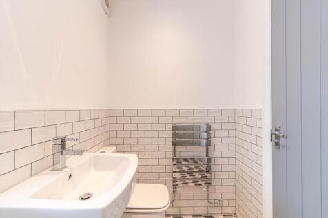 Contemporary small bathroom with white subway t...
