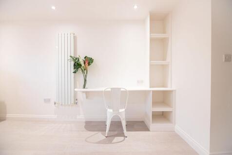 Bright, minimalist workspace with a built-in de...