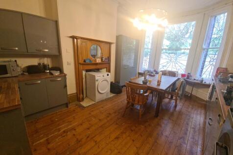 Spacious kitchen with charming wooden flooring ...