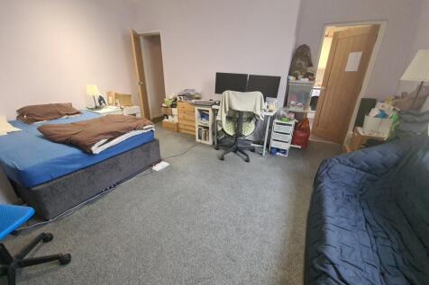 Spacious, well-appointed bedroom with a double ...